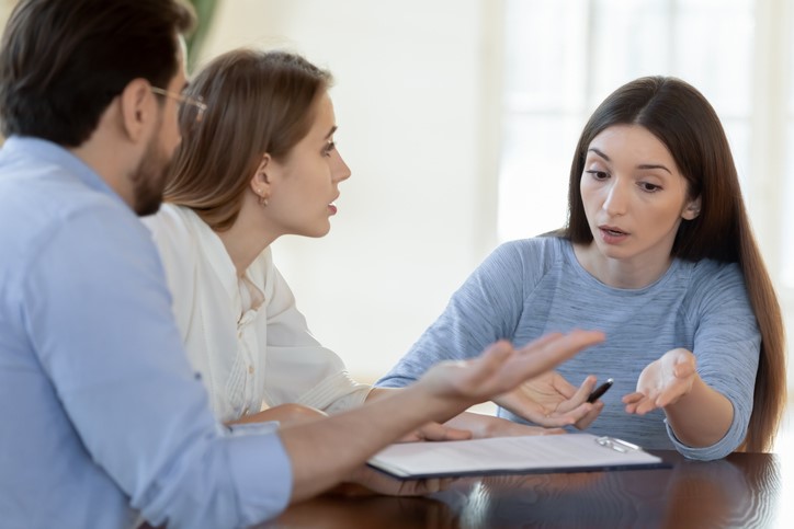 A group of people sitting at a table

AI-generated content may be incorrect.